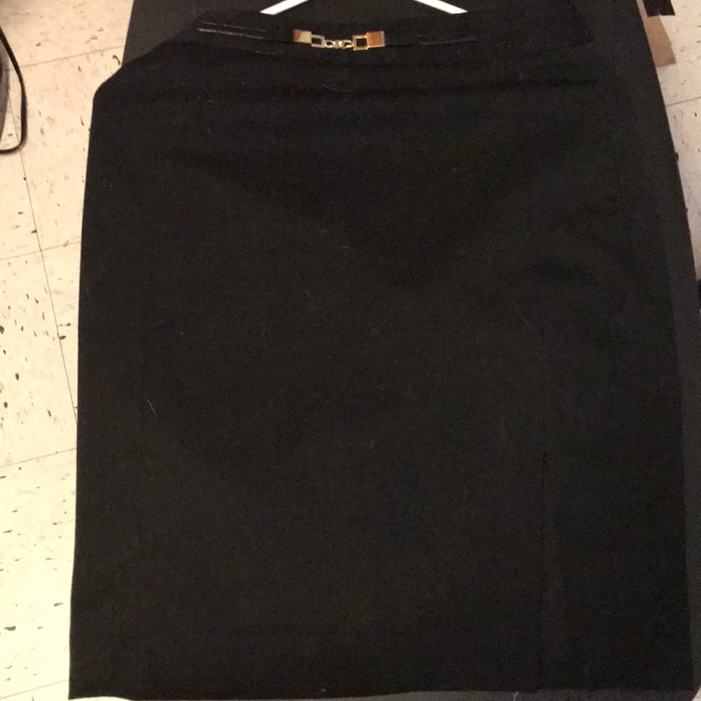 Like new; cute pencil skirt with gold buckle